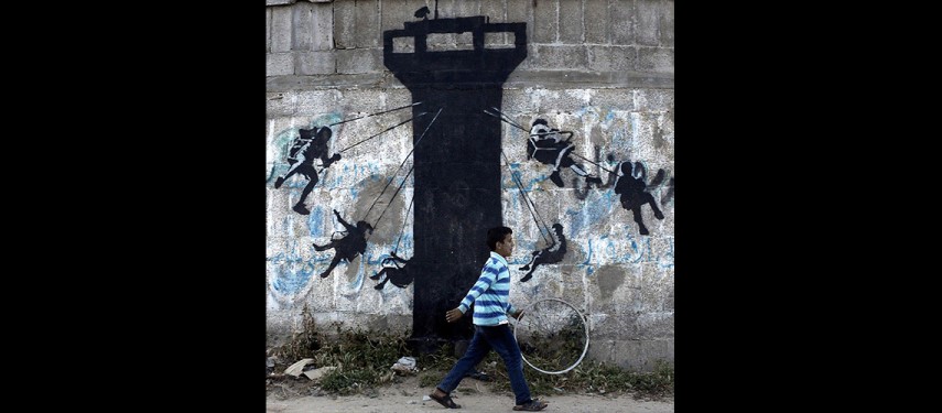 Read more about the article Banksy in Palestine: A look at the street artist’s work in Gaza and the West Bank